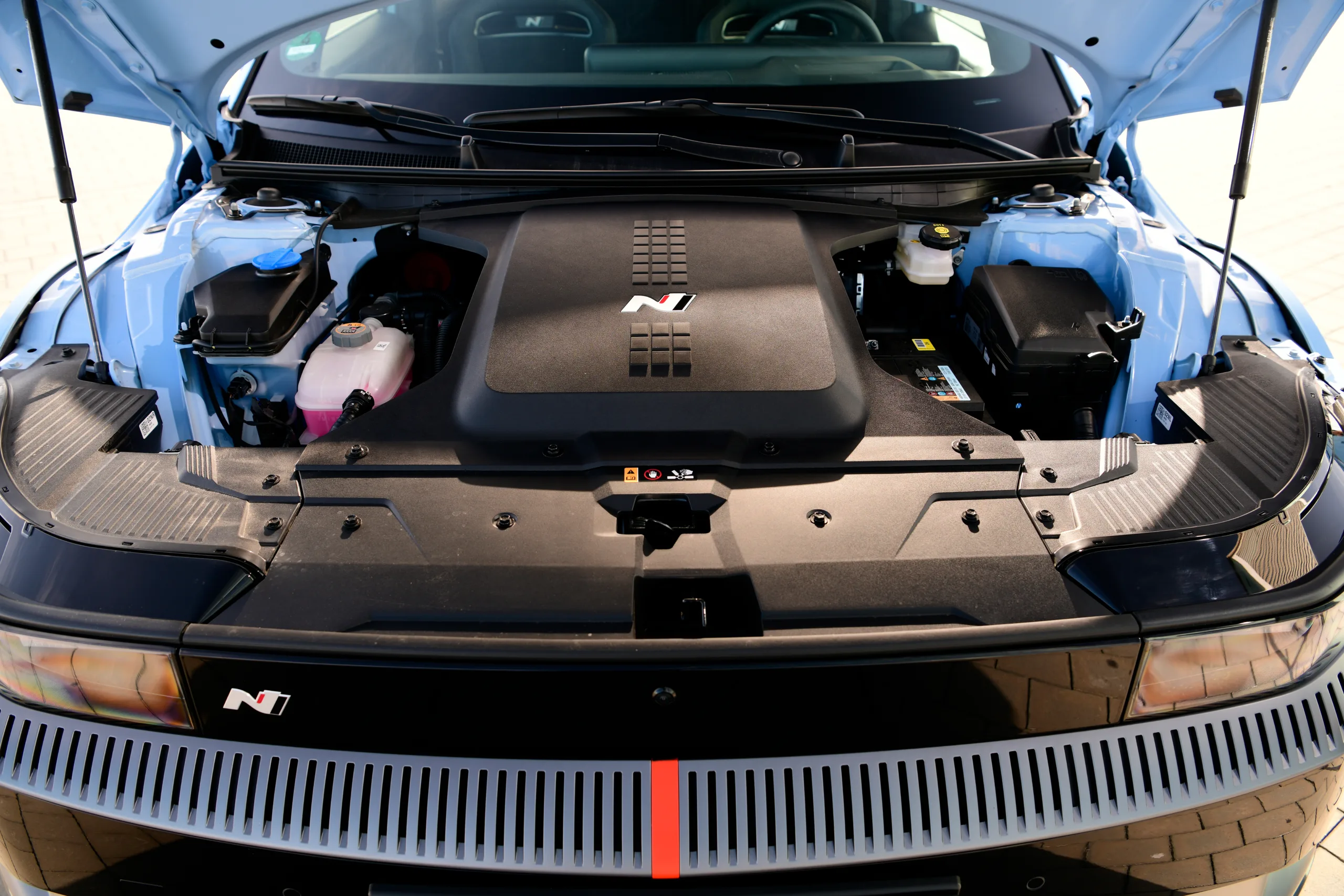 Close-up view of the Hyundai Ioniq 5 N's engine bay highlighting the motor cover with N branding