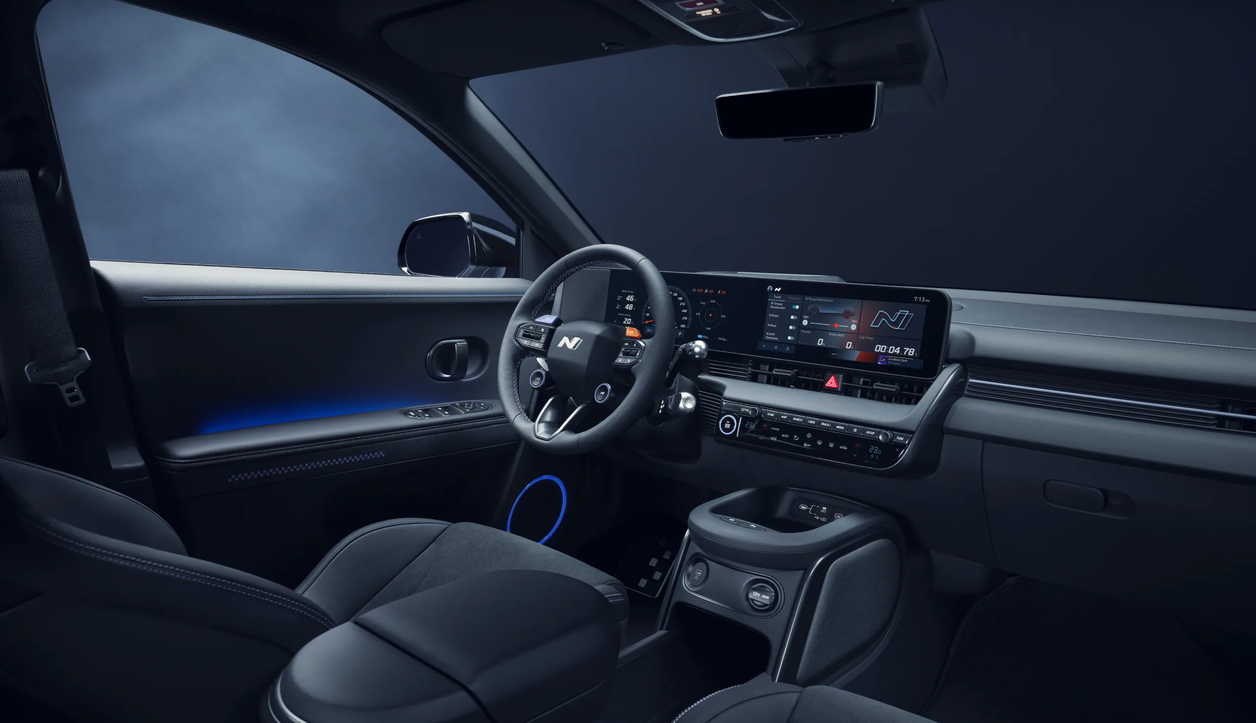 Interior view of the Ioniq 5 N featuring a sporty steering wheel, ambient lighting, and advanced digital displays